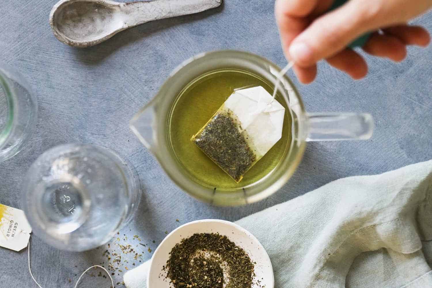 Using Green Tea to Fight Puffiness - cool used tea bags placed on the eyes