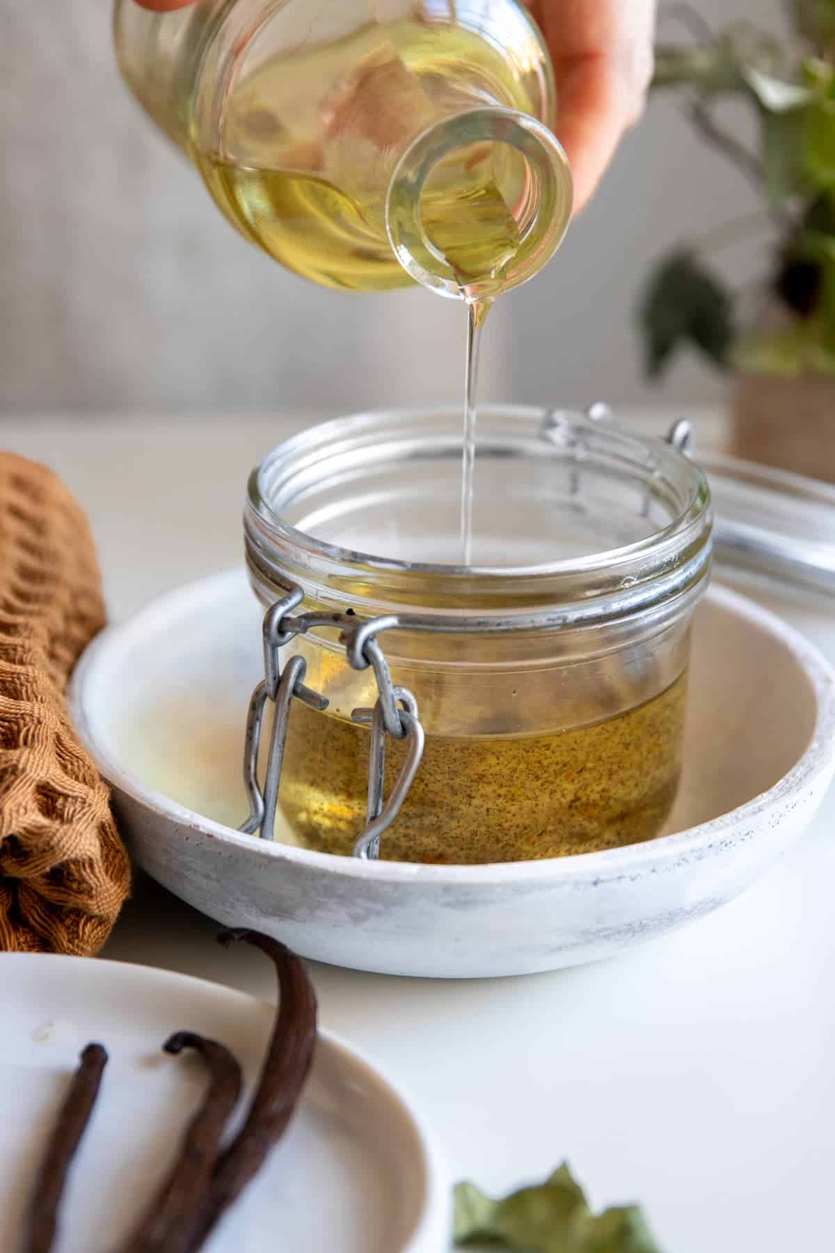 Infuse vanilla bean in carrier oil