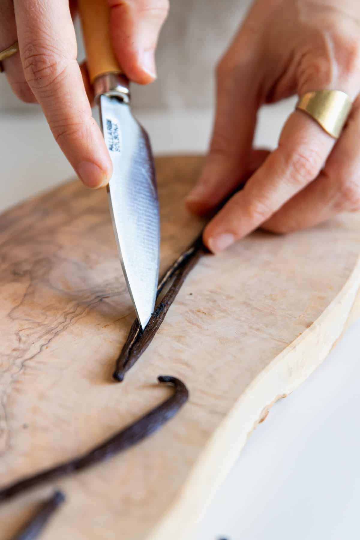 Split and scrape the vanilla beans for infused vanilla perfume